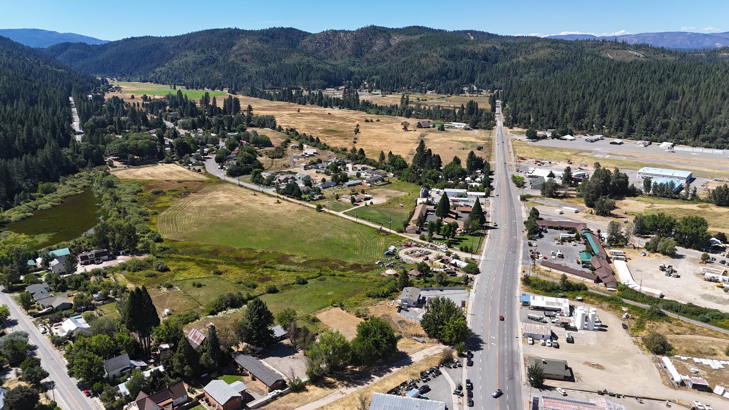 Drone view of a rural transportation corridor and valley context