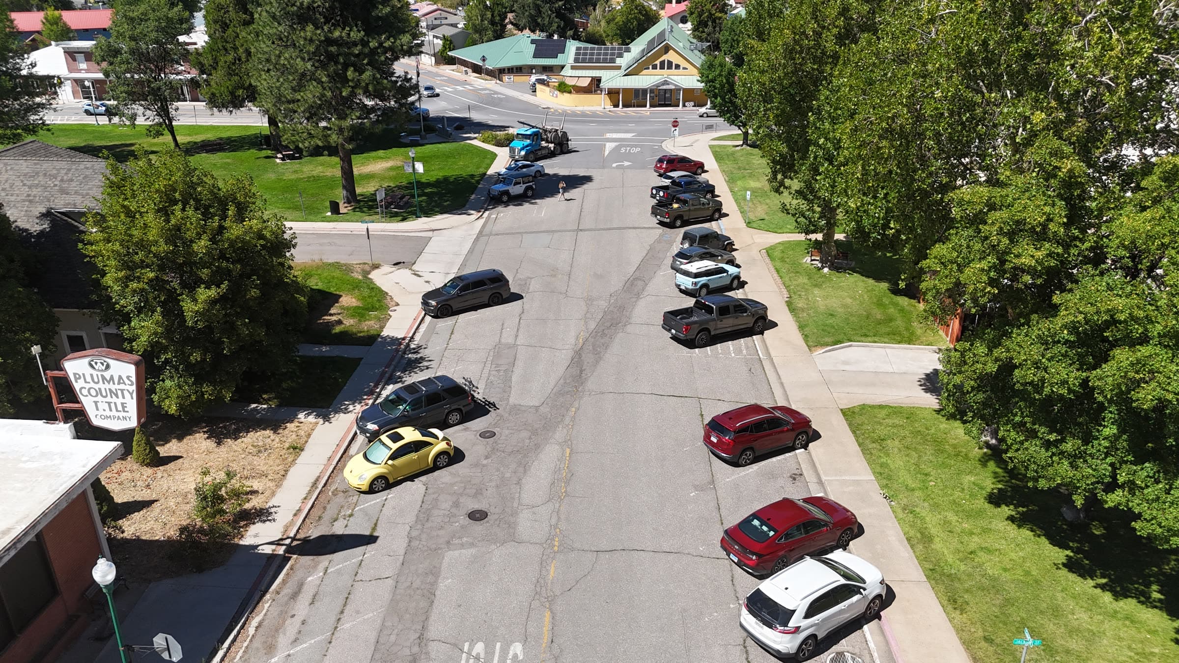 Drone street-level oblique showing curb activity and parking behavior